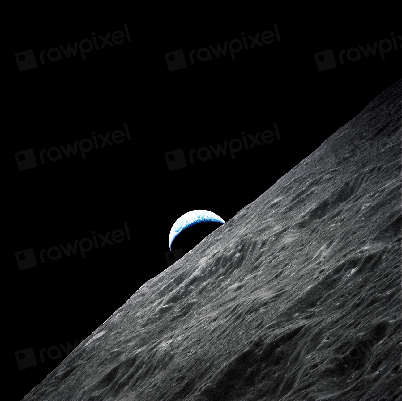 Crescent Earth rises above the lunar