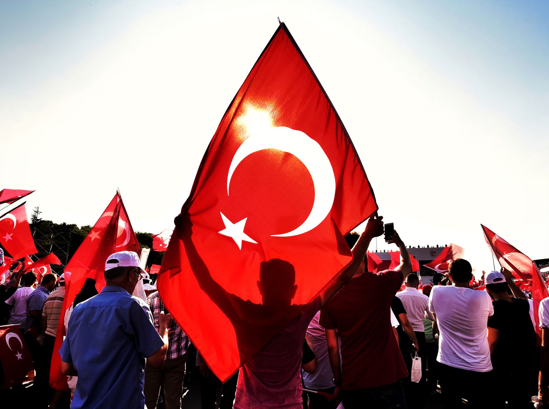 crowd with a turkish flag on a street